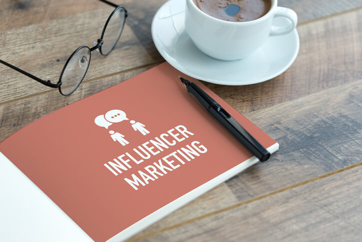 influencer marketing notebpad on table
